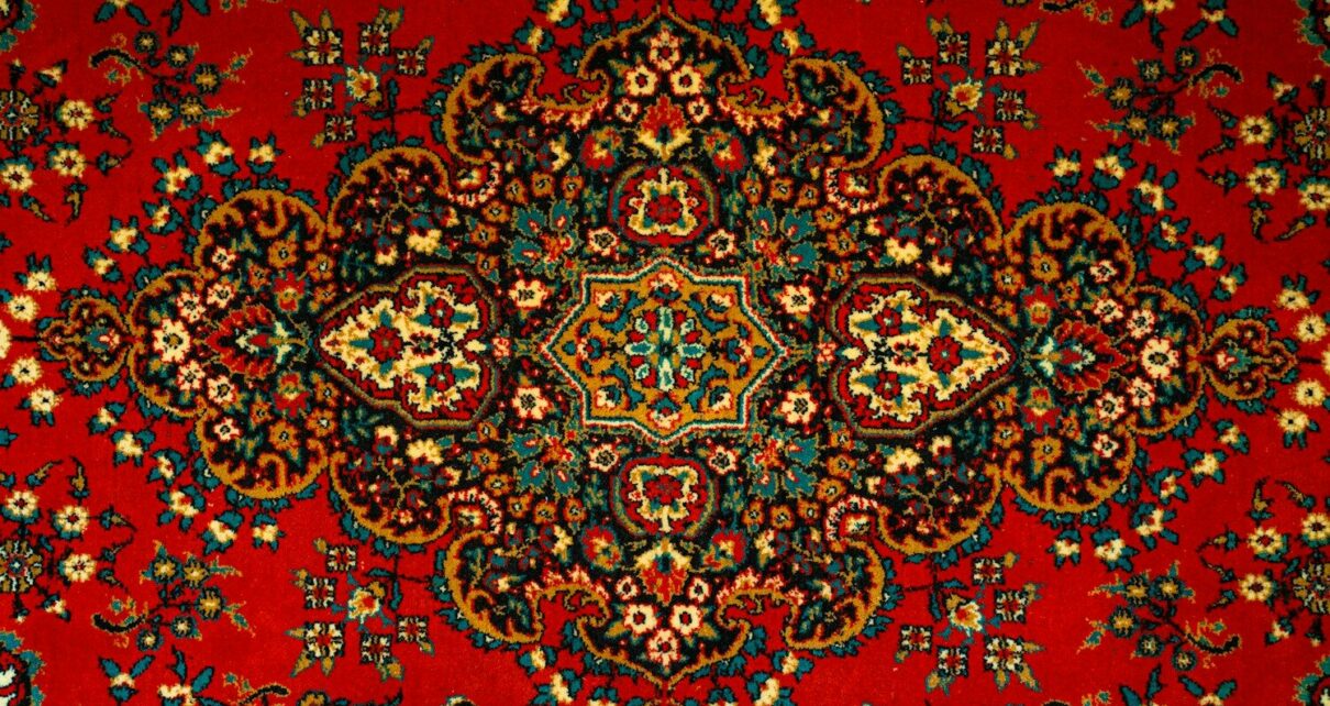a red carpet with a colorful design on it